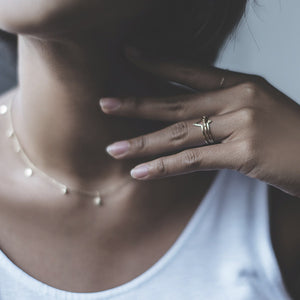 14k gold Malai stacking ring with necklace and other jewelry