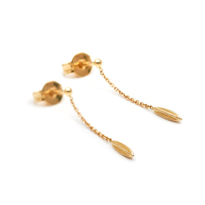 Minimalist solid 14k gold hanging earrings. Delicate fine jewelry.