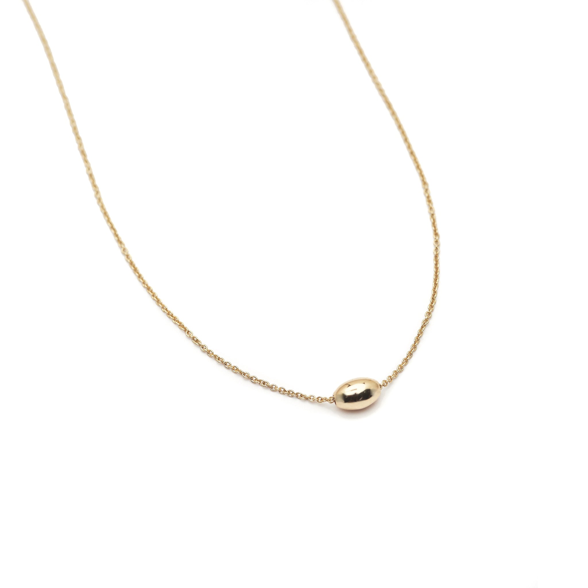 The Straits Finery minimalist necklace in 14k solid gold with fine chain and gold bead