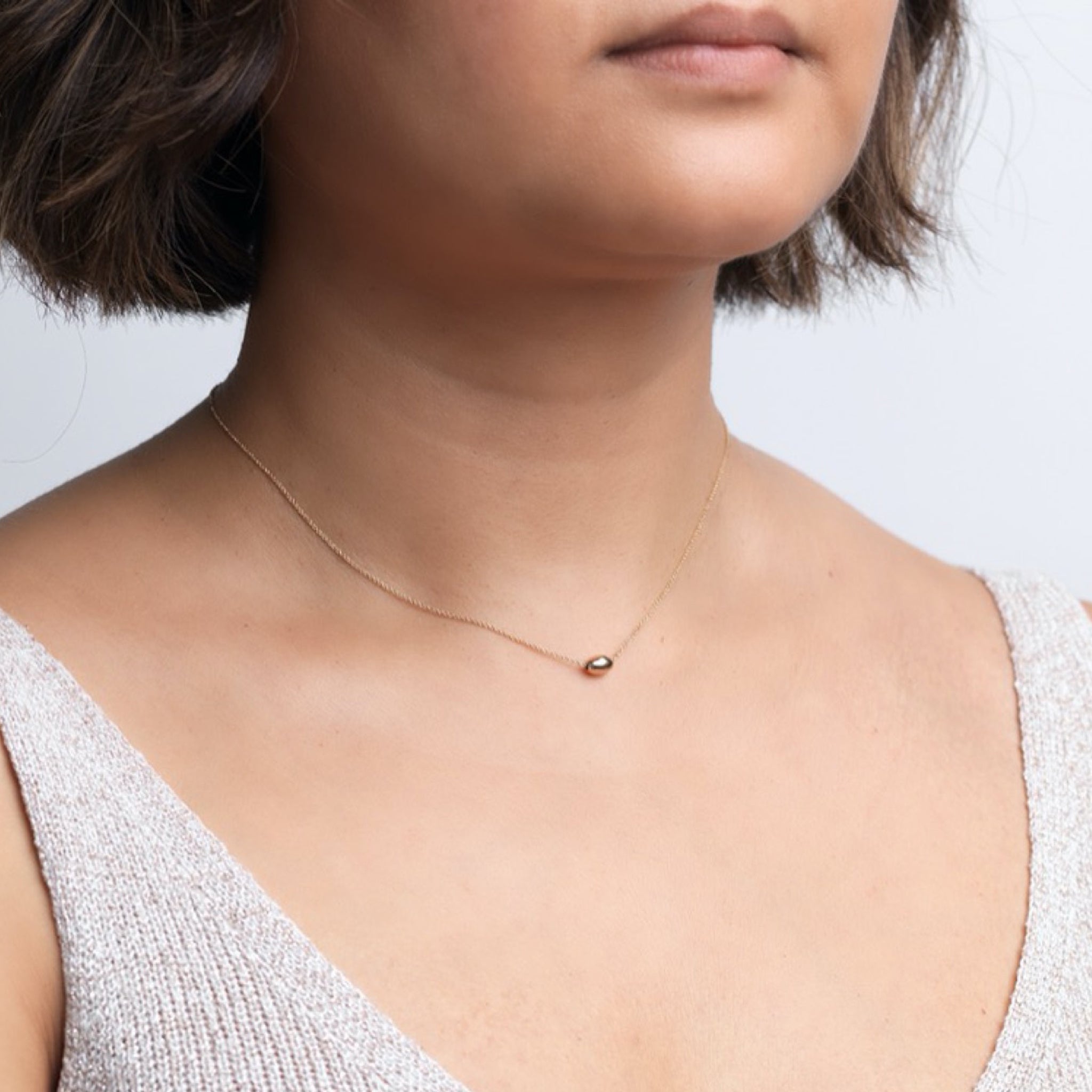 The Straits Finery minimalist necklace in 14k solid gold with fine chain and gold bead